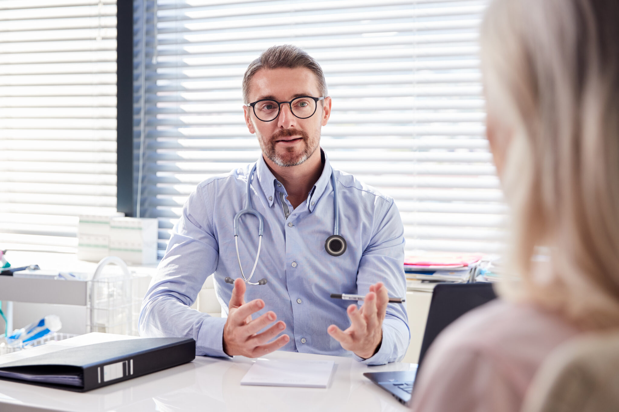 Doctor performing a consultation with a client